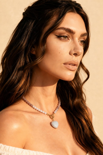 Model wearing heart necklace.png